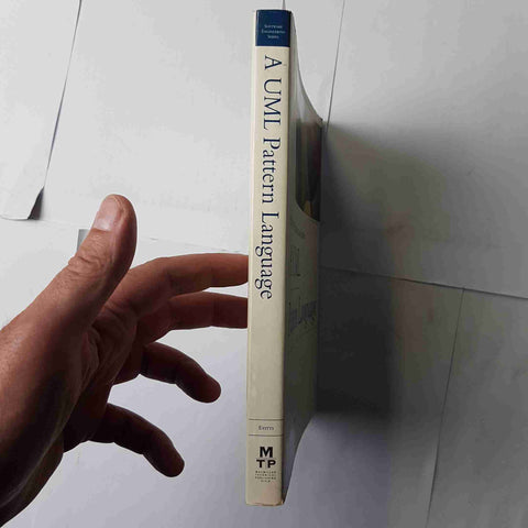 A UML PATTERN LANGUAGE 2000 PAUL EVITTS McMillian